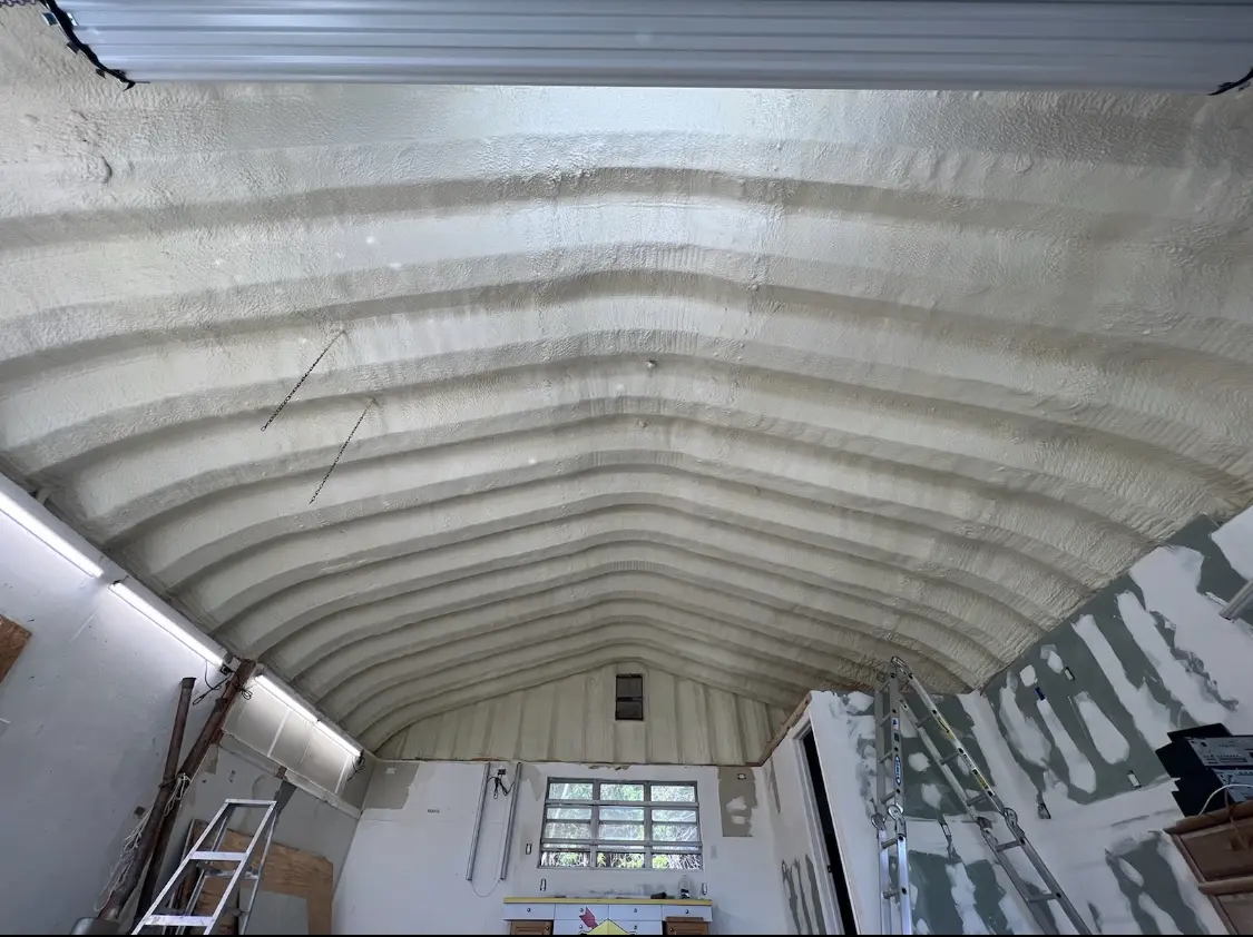 Spray polyurethane foam applied to the underside of a metal roof deck in Deschutes River Woods